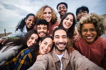 Fotobehang Multiracial young group of happy people taking selfie portrait - Millennial diverse friends laughing and having fun together © Xavier Lorenzo
