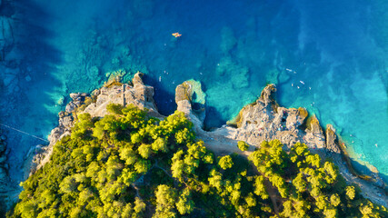 Aerial view on beach and people. Vacation and relax. Beach and blue water. Top view from drone at beach and azure sea. Travel and holiday