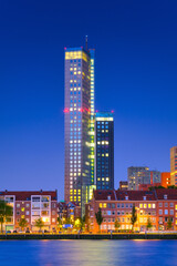 Rotterdam, Netherlands. View of the city center. Old and modern houses. Panoramic view. Cityscape in the evening. Skyscrapers and buildings.