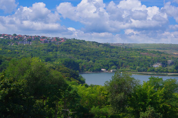 Fototapeta na wymiar Chisinau. Moldova. View from a height of the lake and dense thickets of trees around.