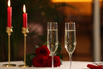 Glasses of champagne on table in restaurant. Romantic dinner