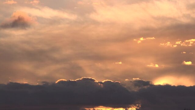 Sunset over lake as serine scene in England relaxes and calms the mind. Golden light water and reeds UK 4K