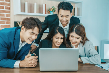 Fototapeta premium Young asian business people looking at screen during video conference in office