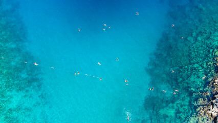 Aerial view of a crowded beach, umbrellas and people on the sand stock photo - Antalya, Kaş