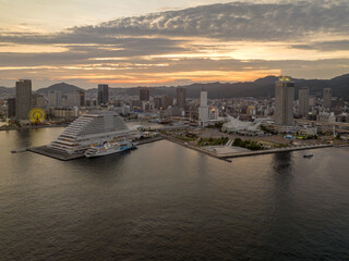 Quiet waterfront along Merikan Park and downtown Kobe City at sunset