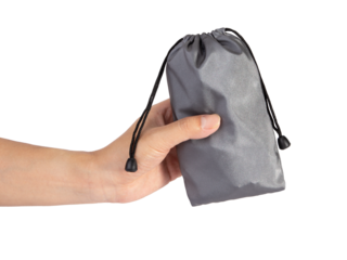 Hand holding a silver color drawstring pouch mockup isolated on white background.