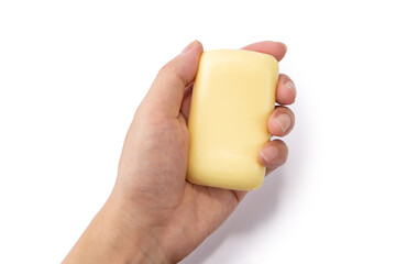 Hand holding a soap bar on the white background