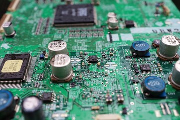 A semiconductor on a printed circuit board wet from the rain.Image: recession, bankruptcy.