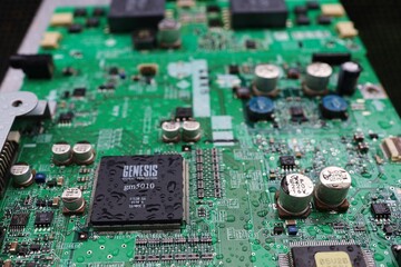 A semiconductor on a printed circuit board wet from the rain.Image: recession, bankruptcy.