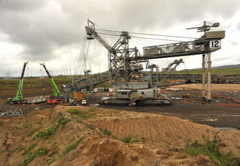 Fototapeta na wymiar Dredge maintenance-replacing bucket wheel on site Yallourn open cut brown coal mine-Victoria, Australia