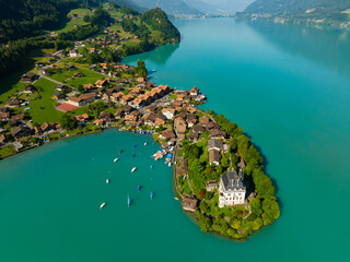 Picturesque Castle Seeburg in the village of Iseltwald at Lake Thun, Switzerland