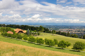 Fototapeta na wymiar Classic Swiss farm house on the hill Gurten above the Swiss capital of Bern, Switzerland