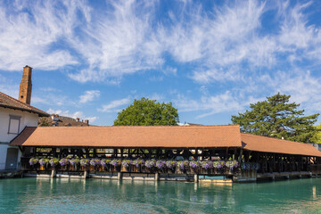 The historic wooden water gate controlling the flow of the river Aare in the city of Thun, Switzerland