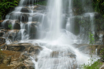 Fototapeta na wymiar Monta-than waterfall in doi suthep-pui national park, chiang mai, thailand (in dark tone)