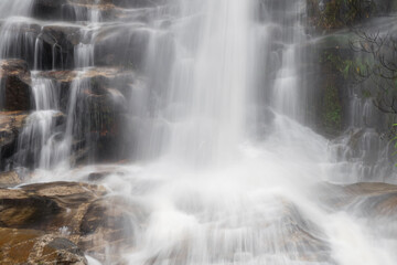 Fototapeta na wymiar Monta-than waterfall in doi suthep-pui national park, chiang mai, thailand (in dark tone)