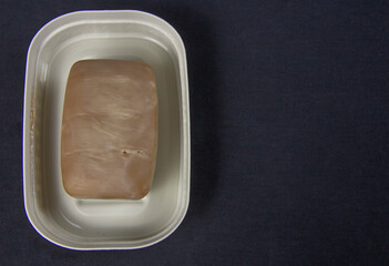 Soap in a soap dish on a black background