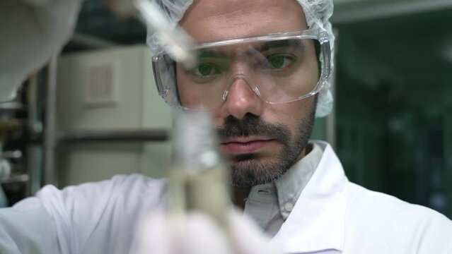 Scientist test CBD hemp oil product in curative CBD lab . The hemp oil contain natural cbd extraction from organic hemp in the farm .