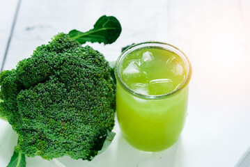Glass of broccoli juice, broccoli Healthy drink on wood back ground, Green vegetable smoothie