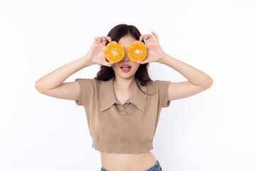 portrait Cute optimistic Asian woman covering her eyes with orange and smiling while looking at the camera. on a white background