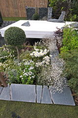 A modern Japanese white garden with flowers