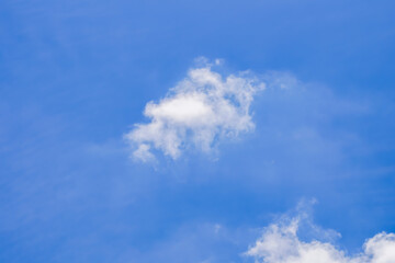 Fototapeta premium blue sky background with small clouds in panoramic view.
