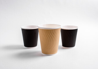 Coffee cups on a white background. Disposable dishes for hot drinks. Logo model.