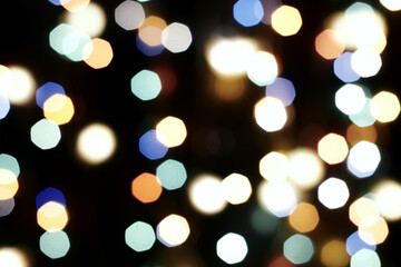 Fototapeta premium multicolored festive lights on a black background screensaver backdrop