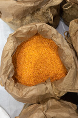 Small Orange Dried Lentils inside a Large Bag