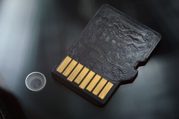 micro sd card lies on the smartphone screen. close-up