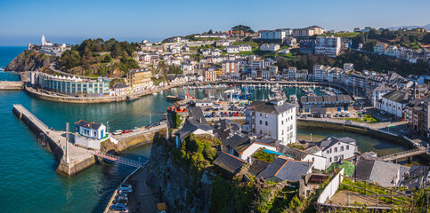 Obraz premium Panorama of the village of Luarca with the small boat harbor and boulevard, Asturias Spain