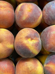 ripe, juicy peaches lie in a box close-up. Energy boost, vitamins, ripe fruits, nectarine cultivation, pesticides. Interruptions in the supply of fruits, imports