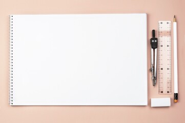 School album for drawing and drawing on a pink background with a copy space.