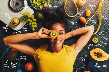Happy woman eat healthy and trains in the gym