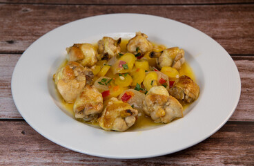 Recipe of chicken drumsticks roasted in olive oil with lemon garlic sauce and glazed vegetables, white turnip, yellow carrot and onions