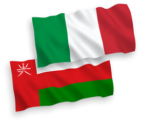 National vector fabric wave flags of Italy and Sultanate of Oman isolated on white background. 1 to 2 proportion.
