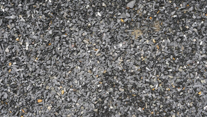 asphalt background. Gray gravel ground.