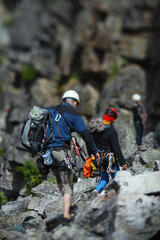 Climbers figures during the competition, abstract blurred image.