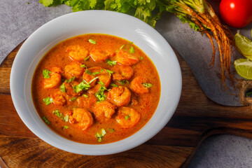 Indian food prawn curry masala with coriander leaves. 