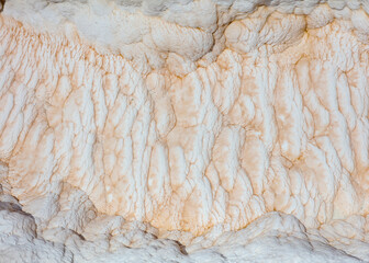 White volcanic limestone rock as background.