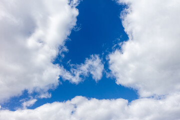 Obraz premium White clouds against the blue sky.