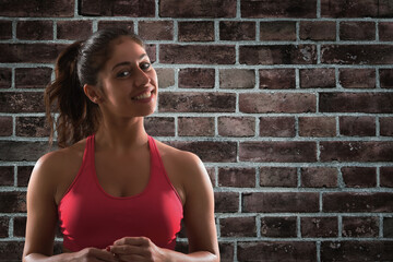 Fototapeta na wymiar Smiling woman at the gym ready to start fitness lesson