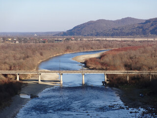 a bridge over a winter river