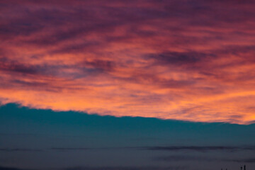 Fototapeta na wymiar cloudy sunset with orange and pink clouds