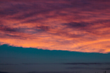cloudy sunset with orange and pink clouds