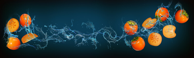 Wallpaper with fruits in water for designers - persimmon is filled with vitamins beneficial to health