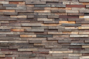 Abstract art background of different weathered plywood and plank board squares and squares stacked.