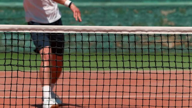 Super Slow Motion Shot of Tennis Player Hit the Net with Ball on Court at 1000fps.