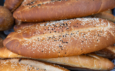 Long fresh baked caucasian bread for sale at the city farmers market