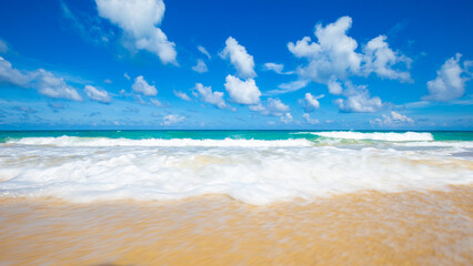 Exotic idyllic white sand sea wave beach blue sky with cloud