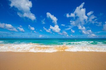 Exotic idyllic white sand sea wave beach blue sky with cloud